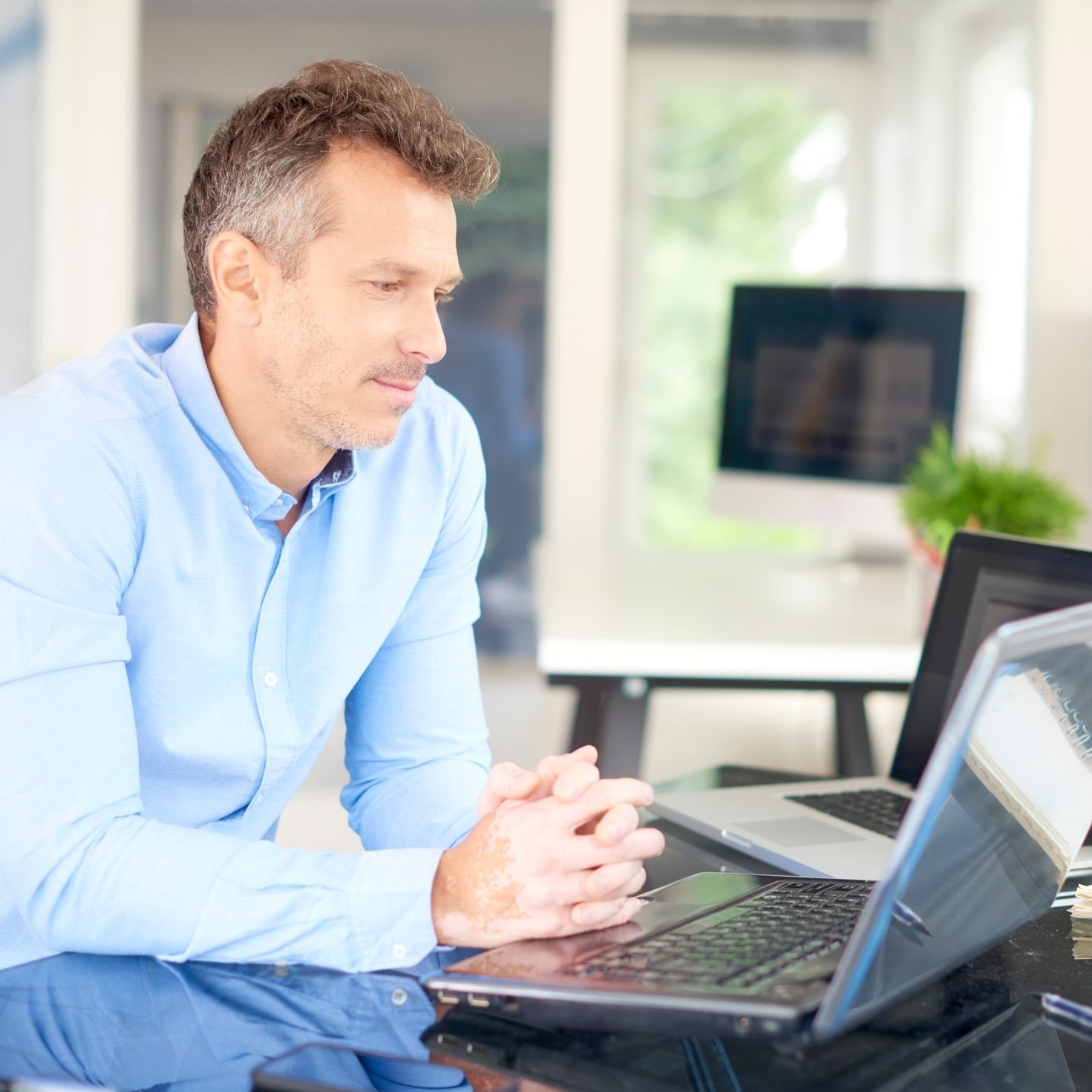 Businessman sitting front laptop