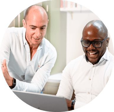 Two people in front of a computer